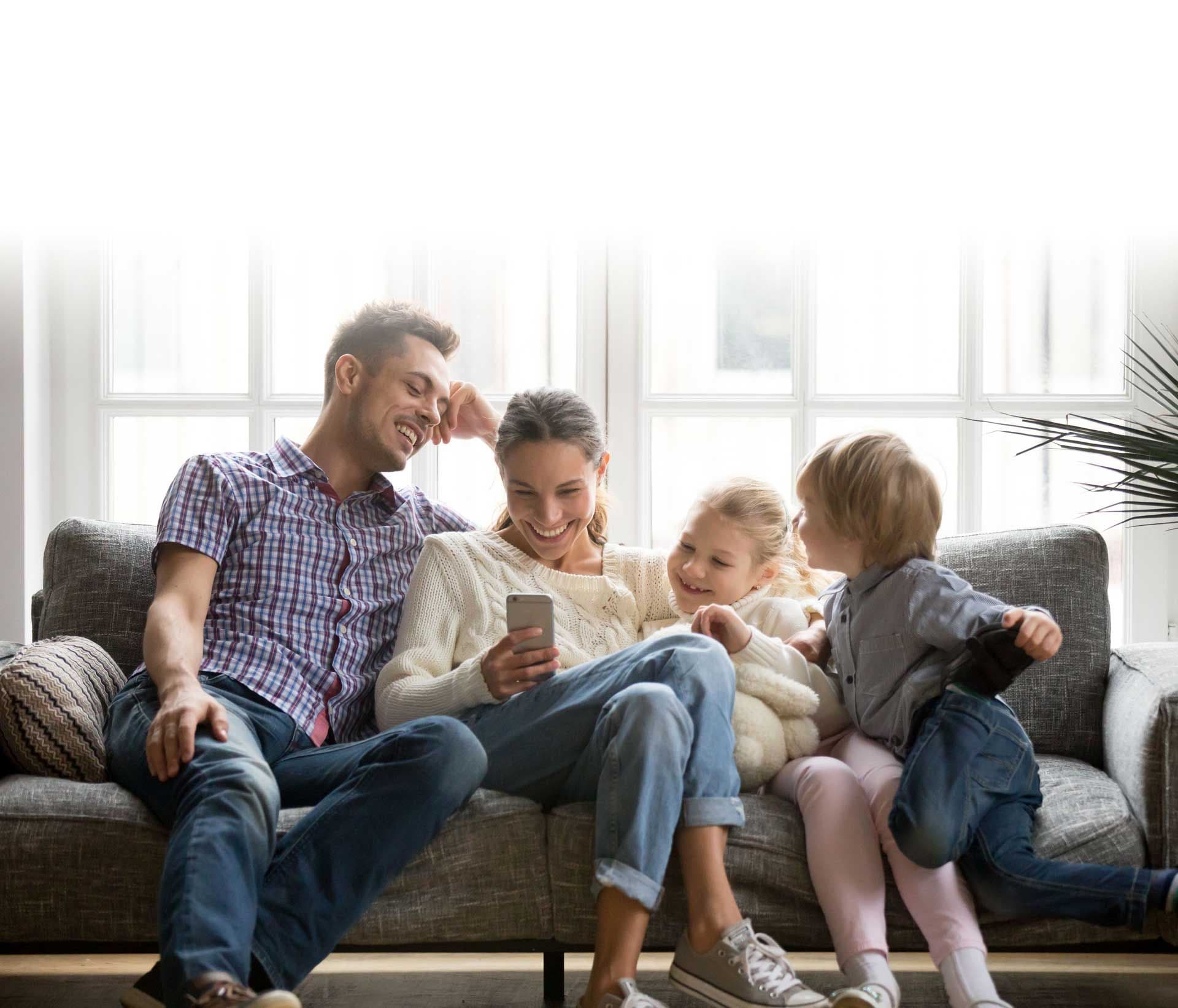 Family sitting on couch
