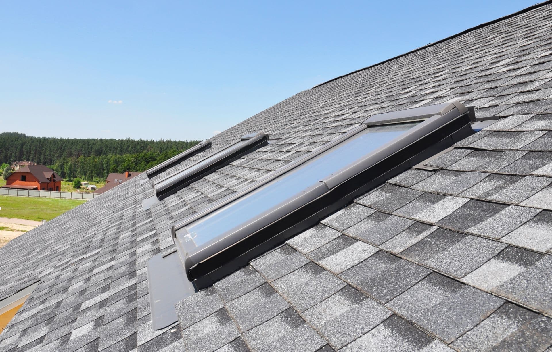 Skylights windows on modern house roof top.