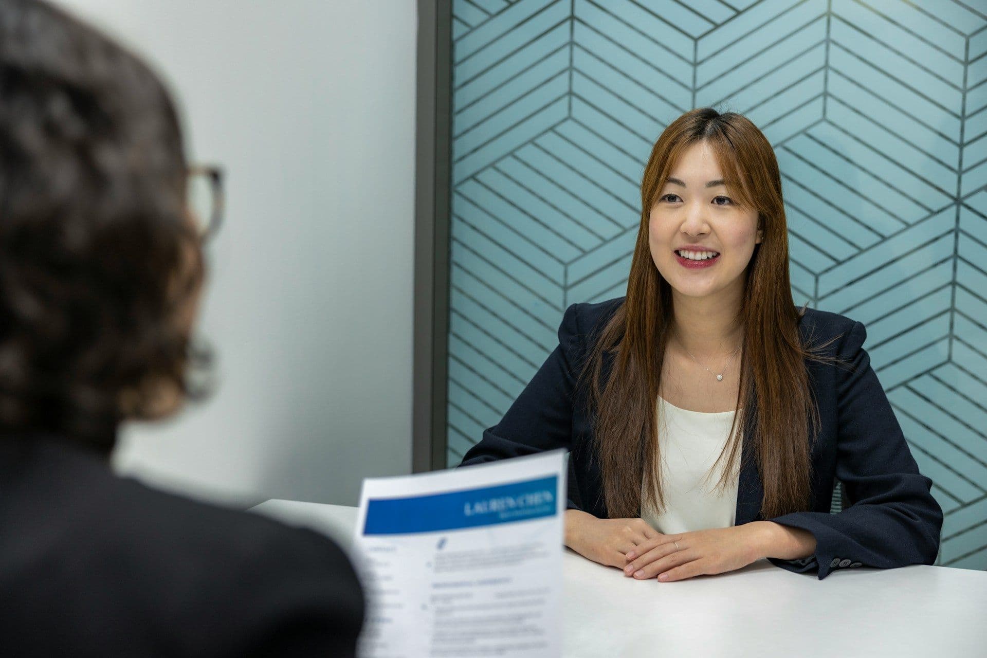 A person interviewing for a job.